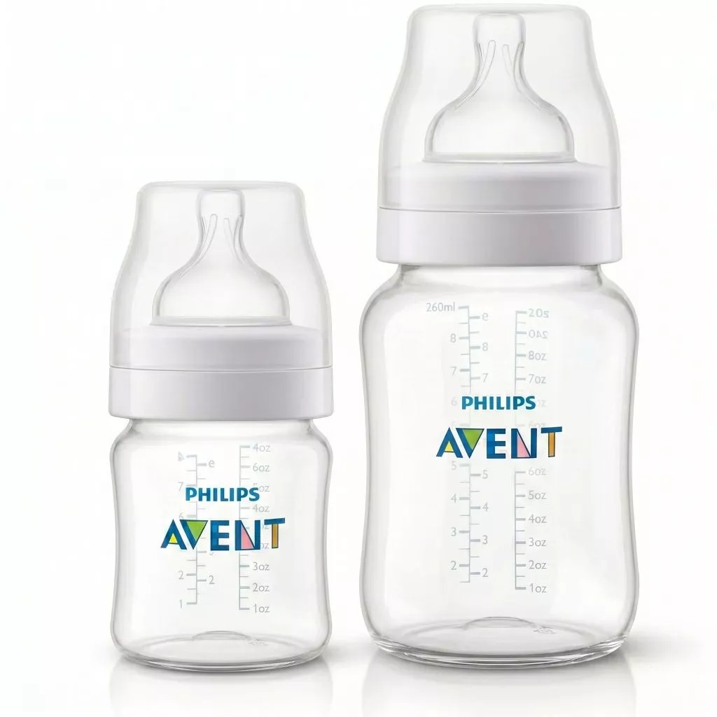 mamadeira-anticólica-philip.jpg Duas mamadeiras transparentes Philips Avent Anti-Colic nos tamanhos 125ml e 260ml, mostrando os bicos clássicos e as marcações de medidas em azul e cinza.